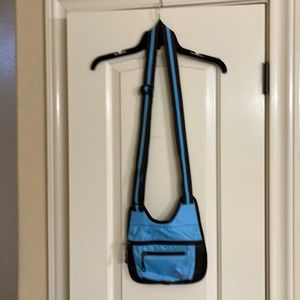 Sherpani Crossbody Lightweight purse in blue with brown accents